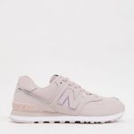 New Balance 574 trainers in pink with iridescent piping
