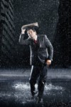 businessman covering head with binder running through rain 1891176